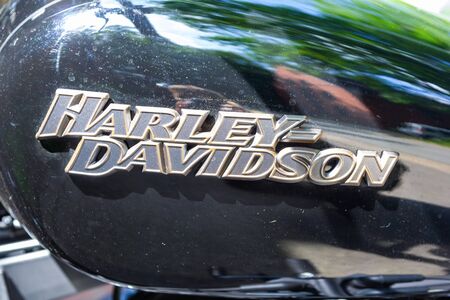 WUNSTORF / GERMANY - JUNE 7,2019: Harley Davidson logo on a black motorcycle. Harley Davidson  is an American motorcycle manufacturer founded in 1903 in Milwaukee, Wisconsin.のeditorial素材