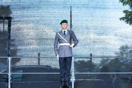 AUGUSTDORF / GERMANY - JUNE 15, 2019: German soldier from the guard battalion walks on a stage at Day of the Bundeswehr 2019.のeditorial素材