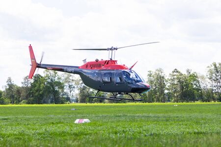BUECKEBURG / GERMANY - JUNE 13, 2019: Bell 206B JetRanger III flies for military training missions over a helicopter landing zone in Bueckeburg.のeditorial素材