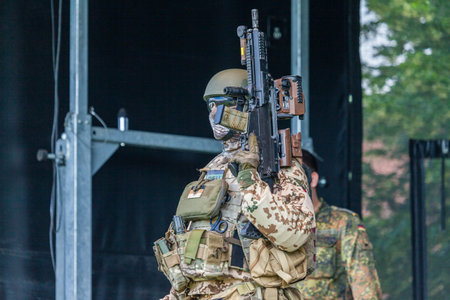 AUGUSTDORF / GERMANY - JUNE 15, 2019: German KSK soldier walks on a stage at Day of the Bundeswehr...