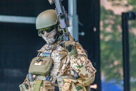 AUGUSTDORF / GERMANY - JUNE 15, 2019: German KSK soldier walks on a stage at Day of the Bundeswehr 2019.のeditorial素材