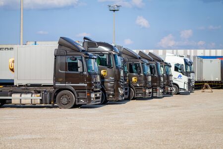 NUREMBERG / GERMANY - AUGUST 4, 2019: Different trucks from the American multinational package delivery, United Parcel Service (UPS), stands near container terminal in Nuremberg.のeditorial素材
