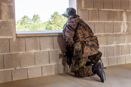 German soldier with a gun at military training areaの写真素材