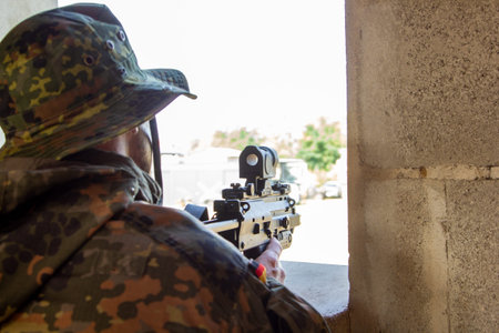 German soldier with a gun at military training areaの写真素材