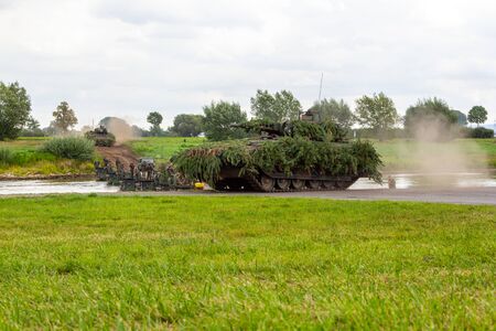 MINDEN / GERMANY - SEPTEMBER 4, 2019: Panzerpionierbattaillon trained a tank crossing over a river with M3 Amphibious Rig. The M3 Amphibious Rig is a self-propelled amphibious bridging vehicle.のeditorial素材