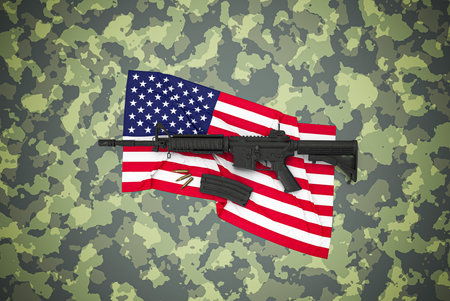 American caliber 5.56 mm rifle on camouflage backgroundの写真素材