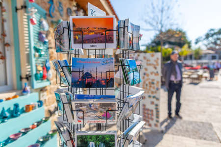 ANTALYA / TURKEY - January 19, 2020: Postcards in a postcard holder in front of a souvenir shopのeditorial素材
