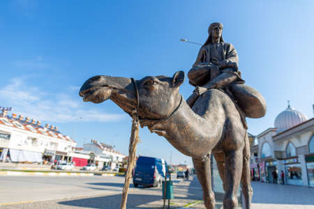 Side, Turkey - January 18, 2020: Camel statue in front of a market at Side, Turkey.のeditorial素材