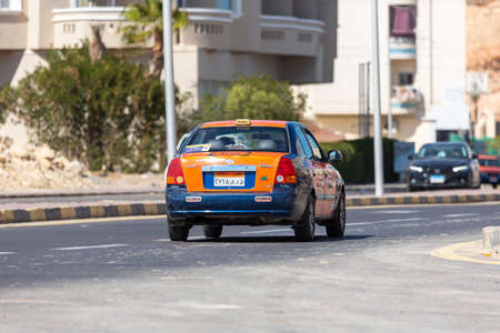 Hurghada, Egypt - January 30, 2022: Taxi cab drives on a street in Hurghada, Egypt.のeditorial素材
