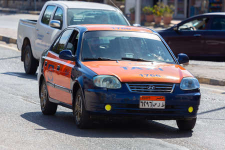 Hurghada, Egypt - January 30, 2022: Taxi cab drives on a street in Hurghada, Egypt.のeditorial素材