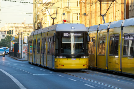 Berlin, Germany - October 7, 2022: Yellow tram drives along a street. The Berlin tramway (German: Strassenbahn Berlin) is the main tram system in Berlin, Germany.のeditorial素材