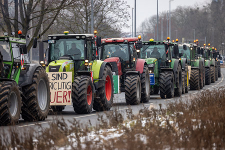 Hannover, Lower Saxony, Germany - January 11, 2024: Farmer protests in Lower Saxony at a large demonstration in Hanover. There are demonstrations against the dismantling of agricultural subsidies.のeditorial素材