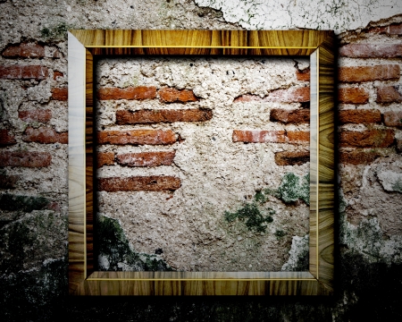 Old picture frame on wall の写真素材