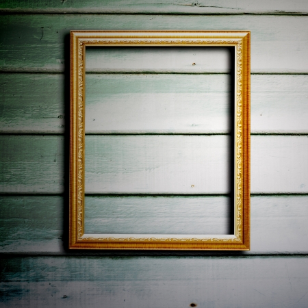 Picture frame on wood wall.の写真素材