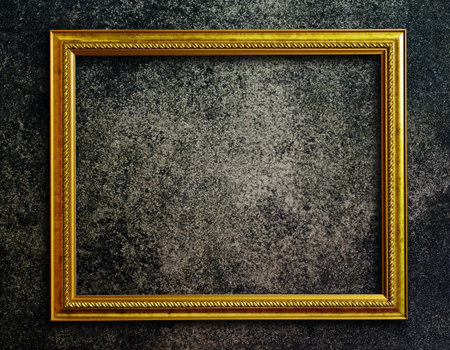 Old picture frame on grunge wall 