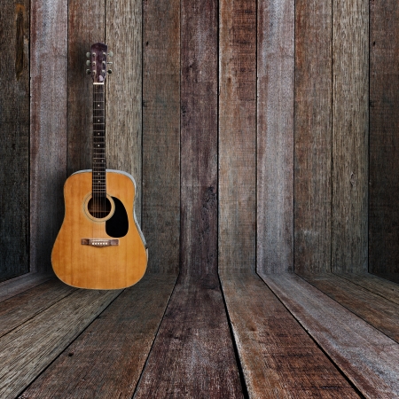 Guitar in vintage wood room.の写真素材