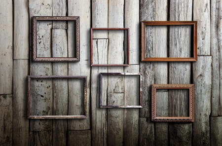 Old picture frame on vintage wood wall の写真素材