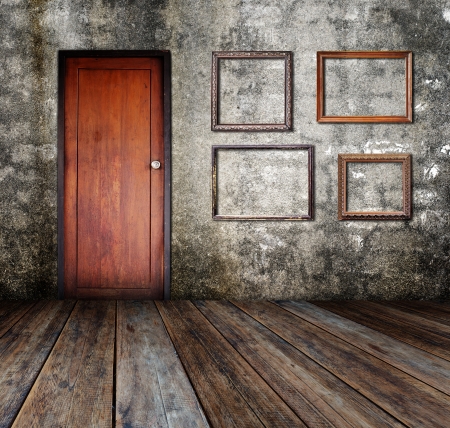 Picture frame put on wall in grunge room の写真素材