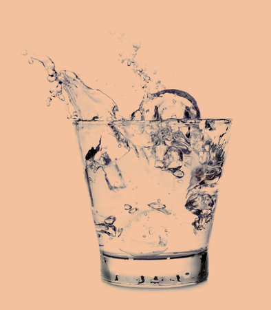 Splashing of water with ice in glass, Vintage styleの写真素材