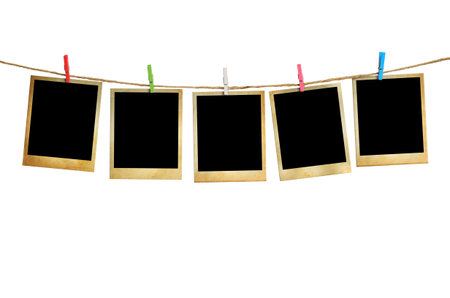Old picture frame hanging on clothesline white background.