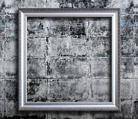 Old picture frame on grunge wall.の写真素材