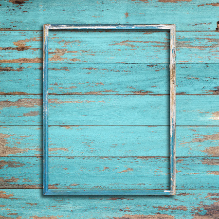 Old picture frame on vintage wood wall.の写真素材