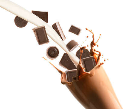 Pouring chocolate and milk into glass with splashing., Isolated white background.の写真素材