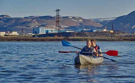 Norilsk, Russia - June 20, 2017: a guy and a girl floating on a kayakのeditorial素材