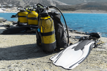diving equipment lies cooked on the beachの写真素材