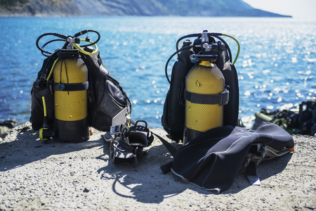 diving equipment lies cooked on the beachの写真素材