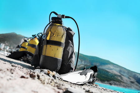 diving equipment lies cooked on the beachの写真素材