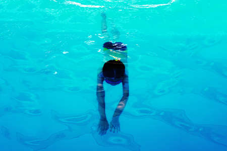 Athlete swimmer swims underwater, top view. Healthy lifestyle and sport concept.の写真素材