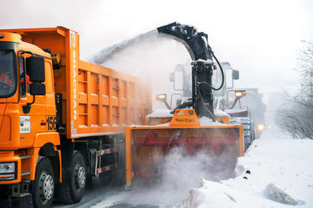 Norilsk, Russia - March 23, 2020: closeup of the snow impeller of an orange snow blowerのeditorial素材