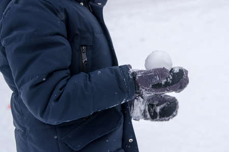 Boy Holding Snowball. Close-Up Of Cropped Hands Holding Snowball.の写真素材