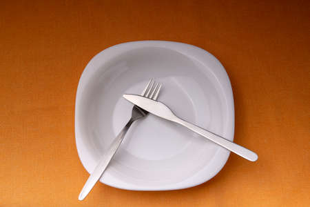 Dining etiquette - I still eat, pause. Fork and knife signals with location of cutlery setの写真素材