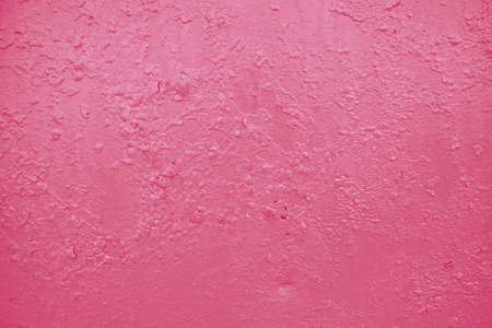 Crackled Paint Background. Wall background. Close-up detail of cracked paint on pink wallの写真素材