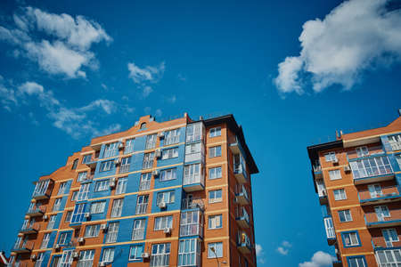 Multi storey building. New modern residential building is ready for living. color house.の写真素材