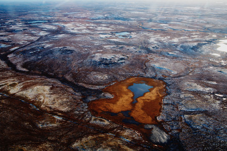 Aerial view and top view of the river in the tundra on the Taimyr Peninsula in Russia. beautiful natural background. Blurred image, selective focus.の写真素材