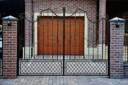 Garage Door. A double garage with blue doors at the end of a drivewayの写真素材