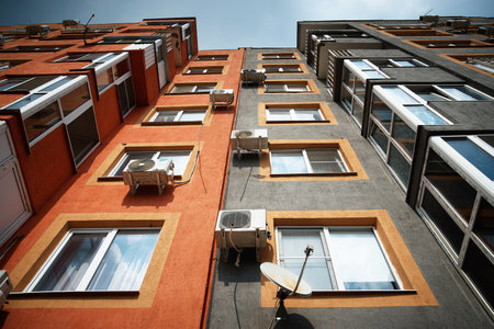 Multi storey building. New modern residential building is ready for living. color houseの写真素材