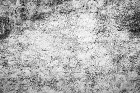 Old wall grunge background with delicate abstract texture and dirty paint. Gray paint with brush and cement wall texture background. The texture of plaster, concrete, stucco.の写真素材