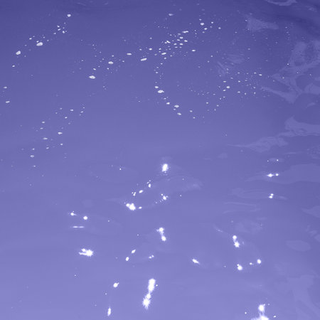 blue water wave texture background. Rippled water. Shiny purple and blue water surface.の写真素材