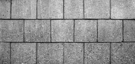 Black and white brick wall background. Detail of av brick wall texture