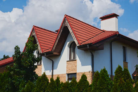 house close-up. cottage in green trees.の写真素材