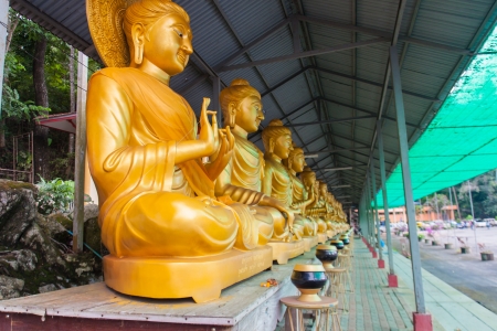 the statue of buddha in different acts in temple of thailandの写真素材