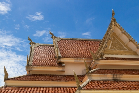 old texture of thai temple roof under blue sky of sunny dayの写真素材