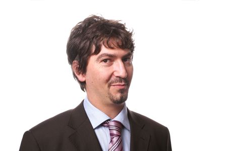 Portrait of a successful young businessman isolated on whiteの写真素材