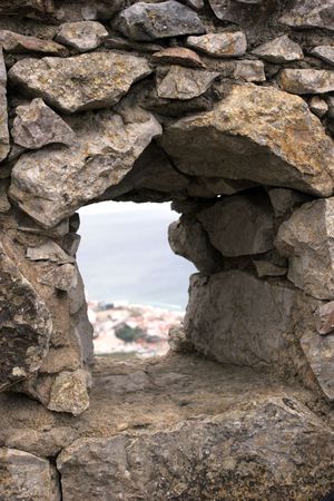 View of a city from a Castle's window - focus on the wall on the first planの写真素材