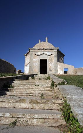 Path to a old church, isolated in blue skyの写真素材