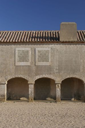 old building with lots of arcs, isolated in blue sky backgroundの写真素材